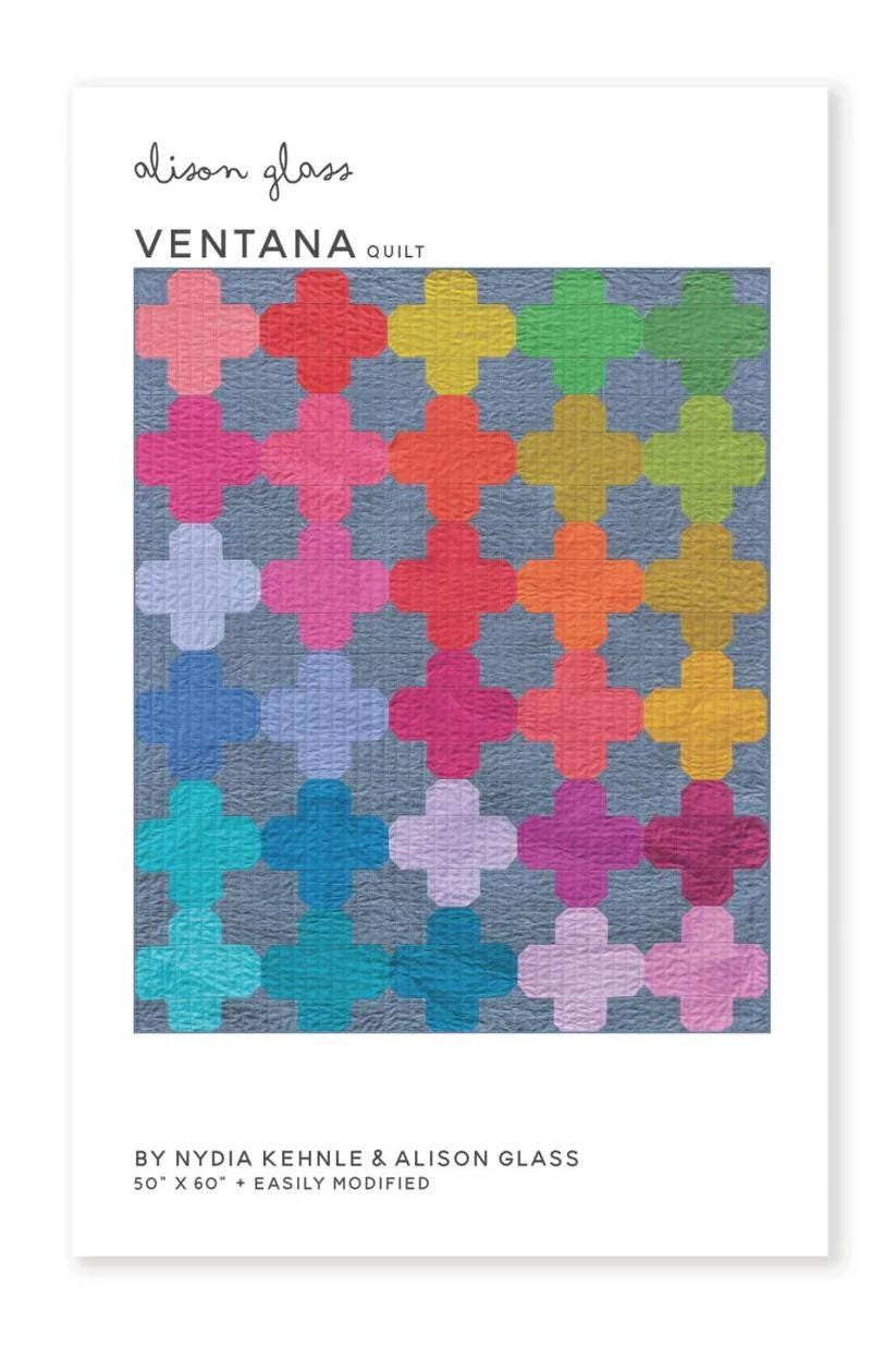 May include: A quilt pattern titled "Ventana" by Alison Glass, featuring a repeating cross design in various colors including pink, orange, green, and blue. The quilt measures 50 x 60 inches and is easily modified.