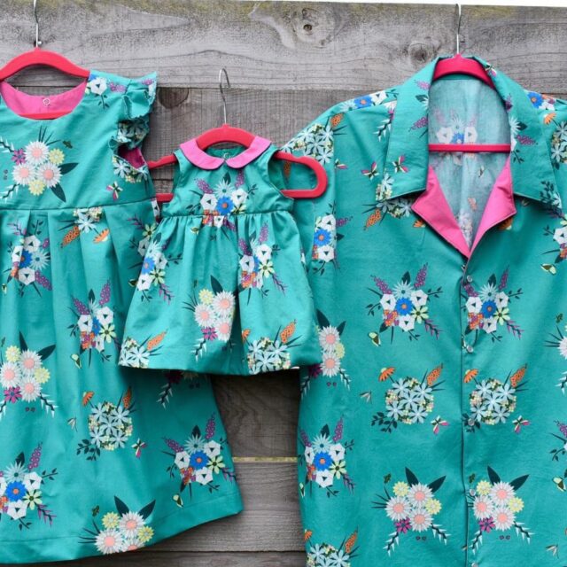teal shirts printed with flowers