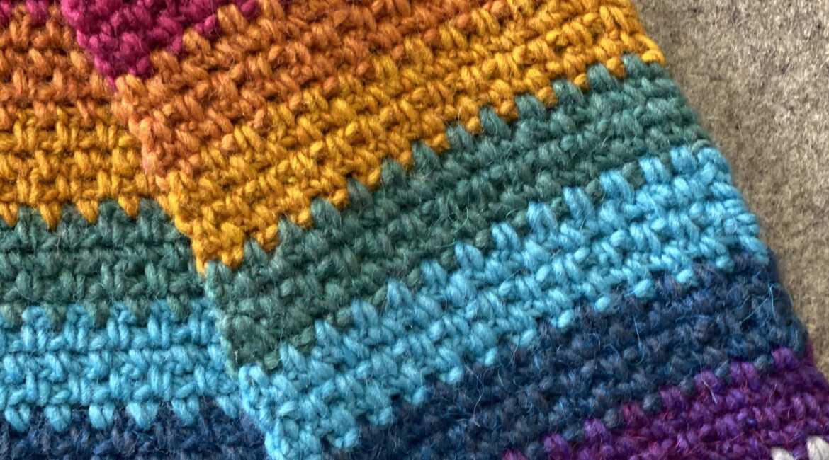 A Colorful crochet on a brown background